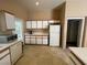 A bright kitchen with white cabinets and modern appliances, offering plenty of counter space at 1667 Marion Bennet Dr, Las Vegas, NV 89106