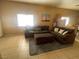 Comfortable living room with neutral-toned furnishings, a cozy rug, and natural light, perfect for relaxation at 1667 Marion Bennet Dr, Las Vegas, NV 89106