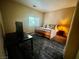 Main bedroom with desk and ensuite bathroom at 1667 Marion Bennet Dr, Las Vegas, NV 89106