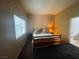 Main bedroom with large window and ensuite bathroom at 1667 Marion Bennet Dr, Las Vegas, NV 89106