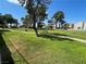 View of the community park with grassy lawn and mature shade trees at 1667 Marion Bennet Dr, Las Vegas, NV 89106