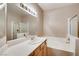 Bathroom featuring double sinks, a shower and separate soaking tub at 1713 Sky Of Red Dr # 203, Las Vegas, NV 89128