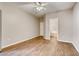 Bedroom with a ceiling fan, wood laminate flooring and an ensuite bathroom at 1713 Sky Of Red Dr # 203, Las Vegas, NV 89128