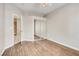 Bedroom with wood laminate flooring, a ceiling fan, and a mirrored closet at 1713 Sky Of Red Dr # 203, Las Vegas, NV 89128