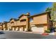 Charming multi-story townhome with private garages, desert landscaping, and a well-maintained facade at 1713 Sky Of Red Dr # 203, Las Vegas, NV 89128