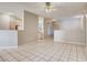 Open-concept living room with tile flooring, neutral paint, and lots of natural light at 1713 Sky Of Red Dr # 203, Las Vegas, NV 89128