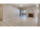 Cozy living room featuring a fireplace and sliding door to the balcony at 1713 Sky Of Red Dr # 203, Las Vegas, NV 89128