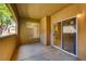 Cozy covered patio offers outdoor living space with sliding glass door access to the indoors at 1713 Sky Of Red Dr # 203, Las Vegas, NV 89128