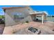 Backyard features a covered patio and built in firepit at 1829 Fighting Falcon Ln, North Las Vegas, NV 89031