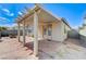 Backyard features a covered patio and stone paver area at 1829 Fighting Falcon Ln, North Las Vegas, NV 89031