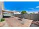 Backyard featuring covered patio and firepit area at 1829 Fighting Falcon Ln, North Las Vegas, NV 89031