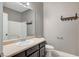 Bathroom features a vanity with sink, toilet, and storage at 1829 Fighting Falcon Ln, North Las Vegas, NV 89031