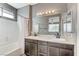 Bathroom featuring dual sinks, shower, and vanity at 1829 Fighting Falcon Ln, North Las Vegas, NV 89031