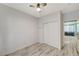 Bedroom with wood-look floors and sliding closet doors at 1829 Fighting Falcon Ln, North Las Vegas, NV 89031