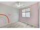 Bedroom with wood-look flooring and rainbow decor at 1829 Fighting Falcon Ln, North Las Vegas, NV 89031