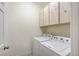 Laundry room with washer and dryer, with overhead storage at 1829 Fighting Falcon Ln, North Las Vegas, NV 89031