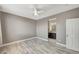 Main bedroom with wood-look tile floors at 1829 Fighting Falcon Ln, North Las Vegas, NV 89031