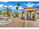 Backyard features a tranquil garden with a water feature and covered gazebo at 1984 Troon Dr, Henderson, NV 89074