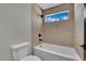Bright bathroom featuring tiled walls, tiled shower and modern fixtures at 1984 Troon Dr, Henderson, NV 89074