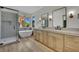 Modern bathroom featuring a walk-in shower, freestanding tub, dual sinks, and stylish fixtures at 1984 Troon Dr, Henderson, NV 89074