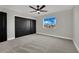 Bright bedroom features new carpeting, ceiling fan and generous closet storage at 1984 Troon Dr, Henderson, NV 89074