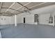 Spacious garage with painted floor and high ceilings; ready for vehicles and storage at 1984 Troon Dr, Henderson, NV 89074
