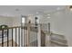 Hallway boasts modern wood and iron railings and access to the upper floor at 1984 Troon Dr, Henderson, NV 89074