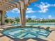 Built in hot tub with a pergola overhead and swimming pool in the backyard at 1984 Troon Dr, Henderson, NV 89074