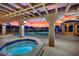 Covered patio featuring a hot tub, lounge area, with backyard views at 1984 Troon Dr, Henderson, NV 89074