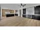 Expansive living room featuring wood floors, custom cabinetry, and modern lighting fixtures at 1984 Troon Dr, Henderson, NV 89074