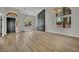 Bright and airy living room featuring high ceilings, a modern fireplace, and stylish hardwood flooring at 1984 Troon Dr, Henderson, NV 89074