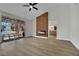 Bright living room with fireplace, wood accent wall, and sliding doors to outdoor living area at 1984 Troon Dr, Henderson, NV 89074