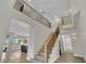 Bright foyer showcasing a staircase with wood and metal railing leading to the second floor at 1984 Troon Dr, Henderson, NV 89074