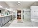 Bright bathroom boasting a modern shower, freestanding tub and double sinks at 2036 Deer Springs Dr, Henderson, NV 89074