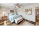 Comfortable bedroom featuring a ceiling fan and closet with wooden flooring at 2036 Deer Springs Dr, Henderson, NV 89074