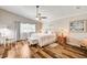 Bedroom with wood floors, a ceiling fan, and natural light from the window at 2036 Deer Springs Dr, Henderson, NV 89074