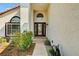 Welcoming front entrance with decorative glass door and colorful landscaping at 2036 Deer Springs Dr, Henderson, NV 89074