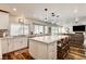 A spacious modern kitchen with stainless appliances, white cabinets, and a large island at 2036 Deer Springs Dr, Henderson, NV 89074