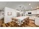 Modern kitchen with white cabinets, stainless appliances, and large central island with barstool seating at 2036 Deer Springs Dr, Henderson, NV 89074