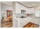 Modern kitchen features white cabinets and stainless steel appliances at 2036 Deer Springs Dr, Henderson, NV 89074