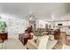 The living area has wood floors and built in shelving with views into the kitchen at 2036 Deer Springs Dr, Henderson, NV 89074