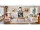 Cozy living room featuring a fireplace, plush seating, and stylish decor at 2036 Deer Springs Dr, Henderson, NV 89074