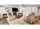 Open concept living area with lots of light, a fireplace, and built in shelving at 2036 Deer Springs Dr, Henderson, NV 89074