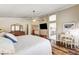 Main bedroom with wood floors and ensuite bathroom with double sinks at 2036 Deer Springs Dr, Henderson, NV 89074