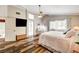 Spacious main bedroom with wood floors, and natural light at 2036 Deer Springs Dr, Henderson, NV 89074