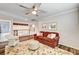 Upstairs sitting room has a cozy sofa and a chair at 2036 Deer Springs Dr, Henderson, NV 89074