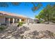 Backyard featuring xeriscape, a patio, and low-maintenance shrubs at 2216 Spring Water Dr, Las Vegas, NV 89134