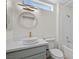 Updated bathroom featuring a modern sink, vanity and stylish mirror at 2216 Spring Water Dr, Las Vegas, NV 89134