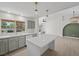 Open kitchen featuring an island, stainless steel appliances, and breakfast bar seating at 2216 Spring Water Dr, Las Vegas, NV 89134