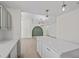 Bright, open kitchen with island, flows into the living area, with modern light fixtures at 2216 Spring Water Dr, Las Vegas, NV 89134